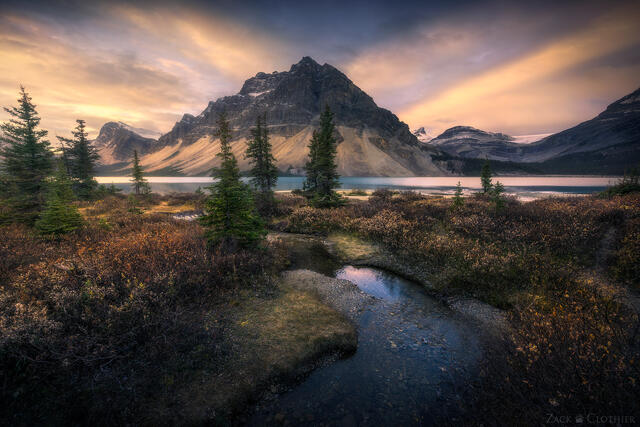 A blazing autumn sunrise over Bow Lake in Banff National Park in the Canadian Rockies