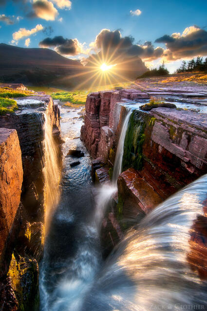 Sunrise over waterfall in Glacier National Park, Montana