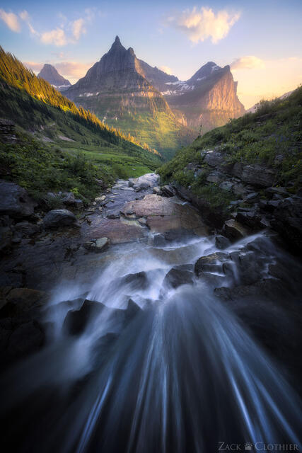 Waterfall at sunset over hanging valley, Glacier National Park, Montana