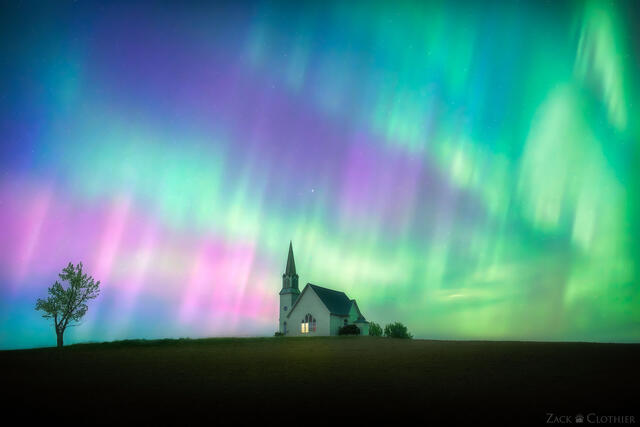 Spectacular auroras dance above a small church in rural eastern Washington