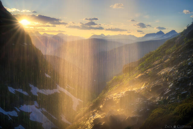 Waterfall and mountains at sunset, Glacier National Park, Montana