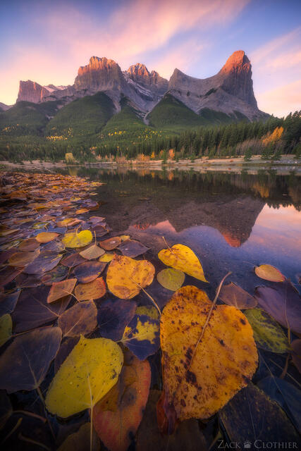 Canadian Rockies reflecting in small lake in autumn, Canmore, Alberta Canada