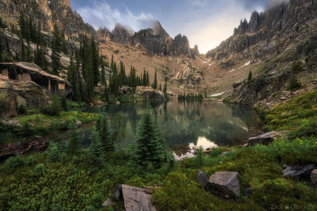 Mountain lake in remote alpine cirque in the Idaho Rocky Mountains at sunrise