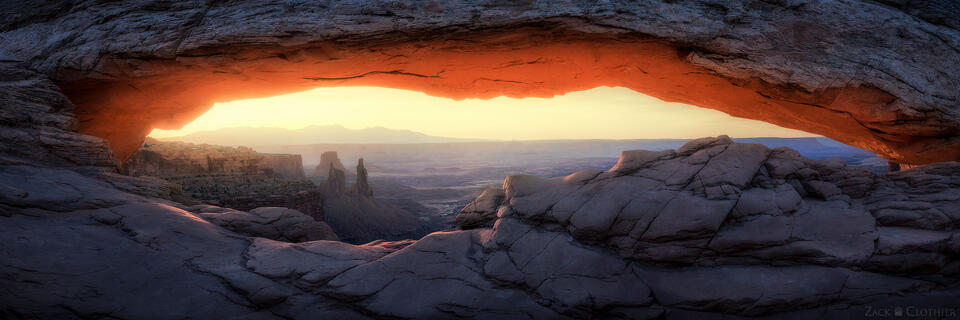 Panoramic view through Mesa Arch at sunrise, Canyonlands National Park, Utah
